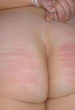Caned bottom and tied wrists